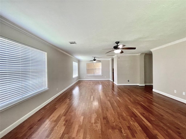 unfurnished living room with dark wood-type flooring, ceiling fan, and ornamental molding