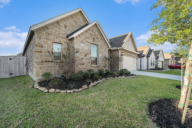 view of front of house featuring a front yard and a garage