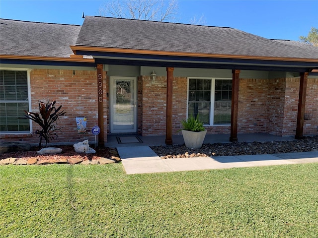 entrance to property with a yard