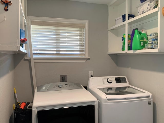 laundry room with washer and dryer