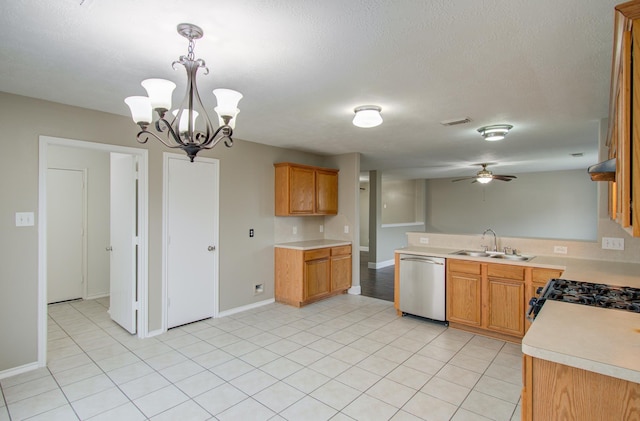 kitchen with pendant lighting, dishwasher, ceiling fan with notable chandelier, sink, and range with gas stovetop