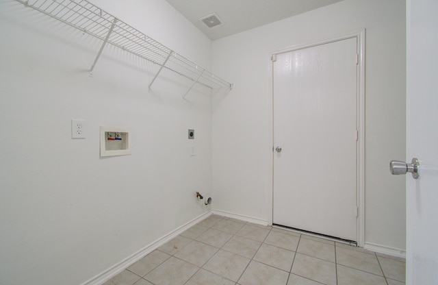 laundry room featuring light tile patterned floors, washer hookup, and hookup for an electric dryer