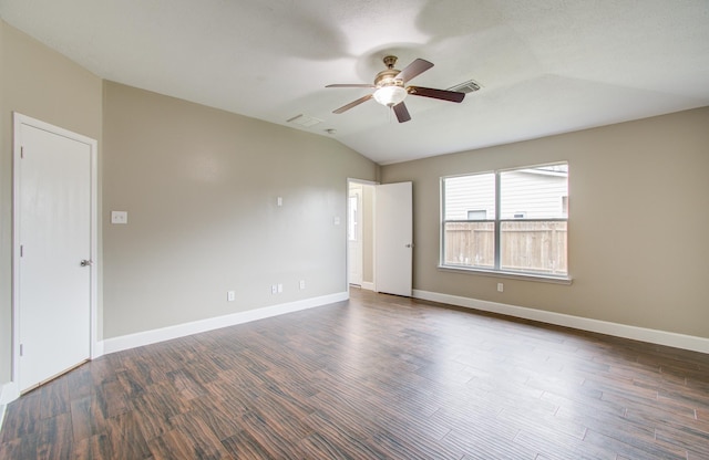 empty room featuring dark wood-type flooring, ceiling fan, and lofted ceiling