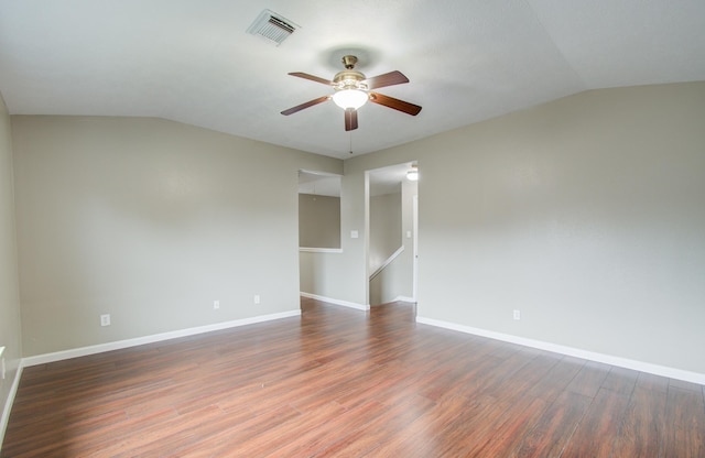 unfurnished room featuring ceiling fan, dark hardwood / wood-style flooring, and vaulted ceiling