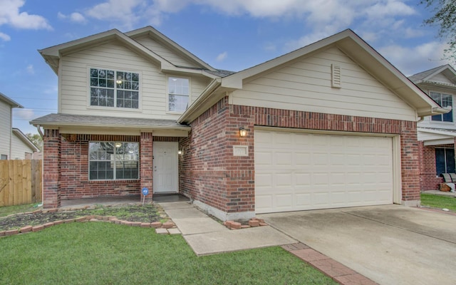 view of front of home featuring a front yard and a garage