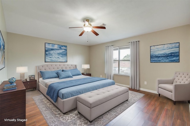 bedroom with wood-type flooring and ceiling fan