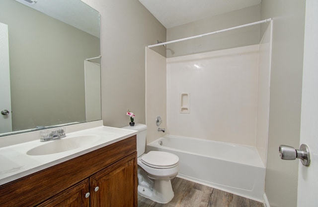 full bathroom with shower / bath combination, vanity, toilet, and wood-type flooring