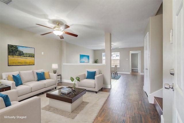 living room featuring ceiling fan and wood-type flooring