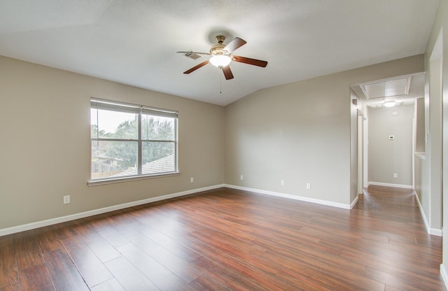 unfurnished room with ceiling fan, lofted ceiling, and dark wood-type flooring