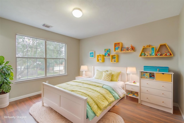 bedroom featuring wood-type flooring