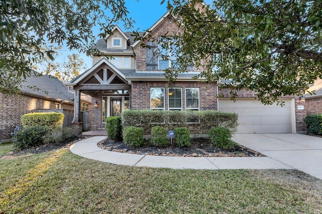 view of front facade featuring a garage and a front yard