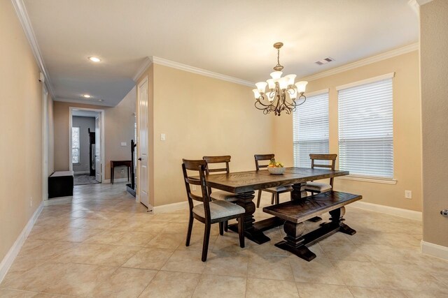 tiled dining room featuring a notable chandelier and crown molding