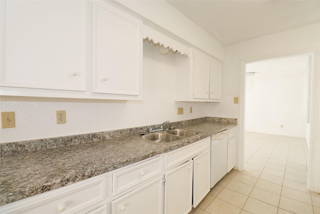 kitchen featuring white cabinets, light tile patterned flooring, dishwasher, and sink