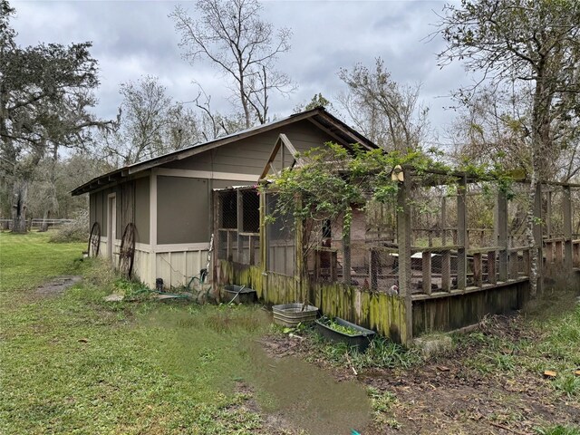 view of home's exterior featuring an outdoor structure