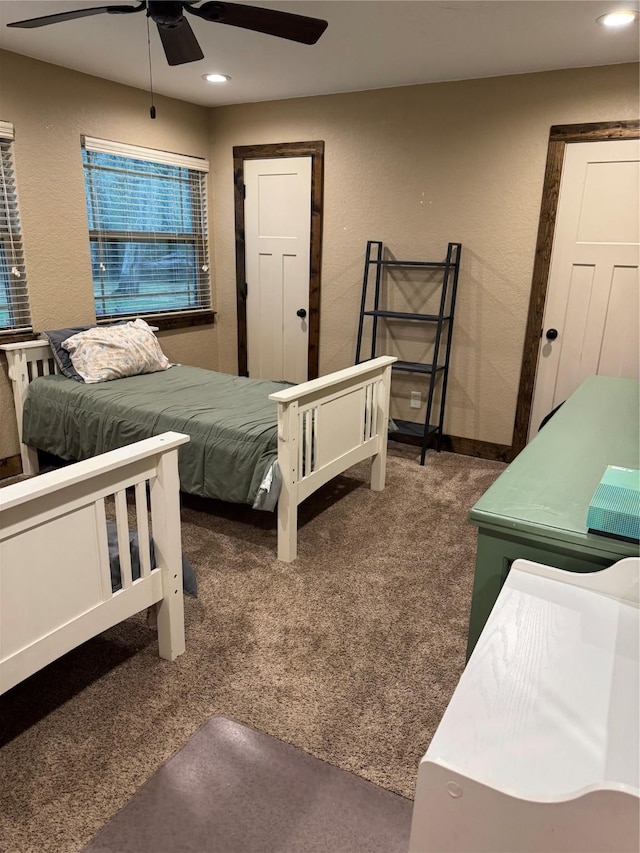 carpeted bedroom with ceiling fan