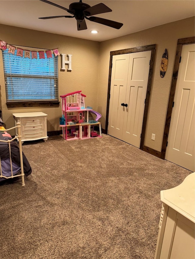 bedroom featuring carpet flooring, ceiling fan, and a closet