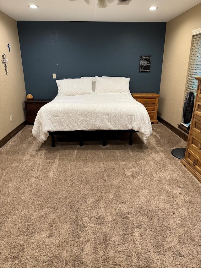 carpeted bedroom with ceiling fan