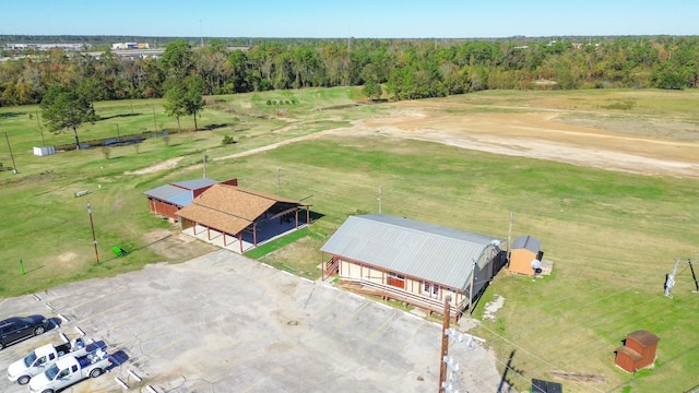 birds eye view of property with a rural view