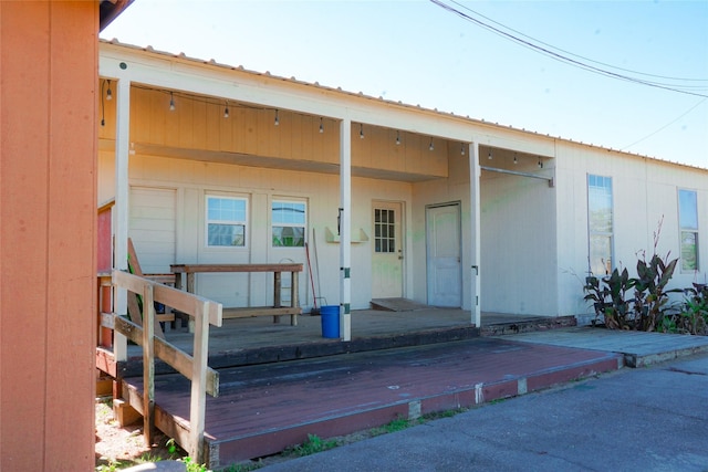 entrance to property featuring a deck