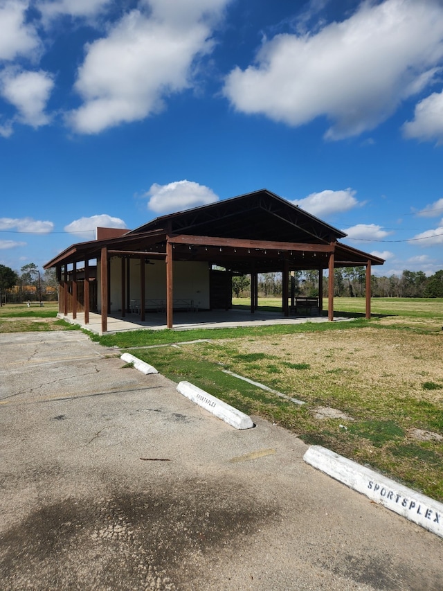 surrounding community with a gazebo and a lawn