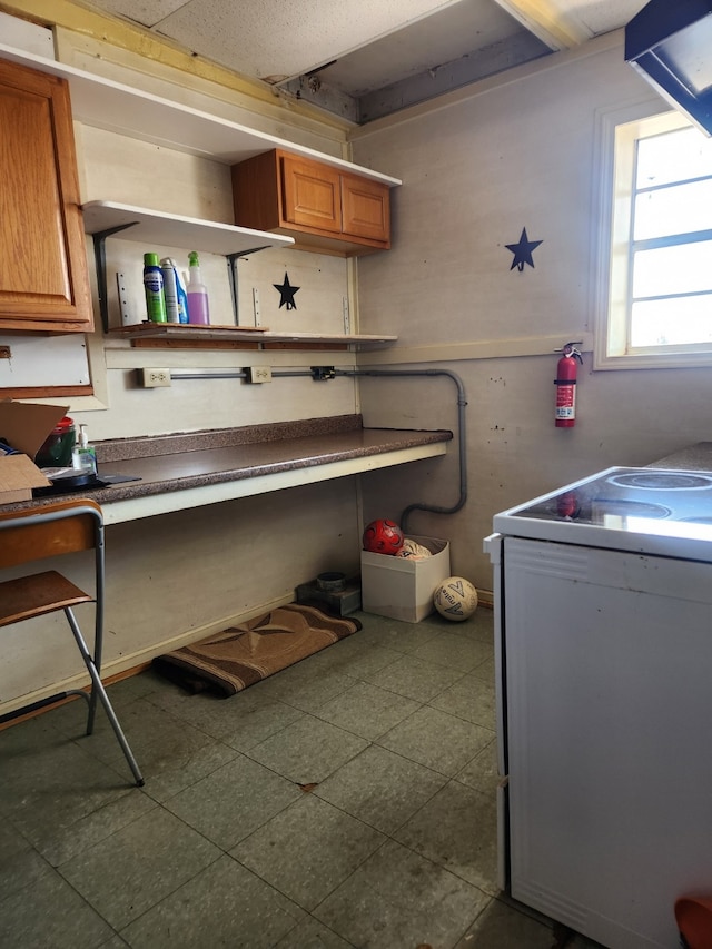 clothes washing area featuring cabinets