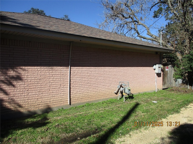 view of property exterior with a yard