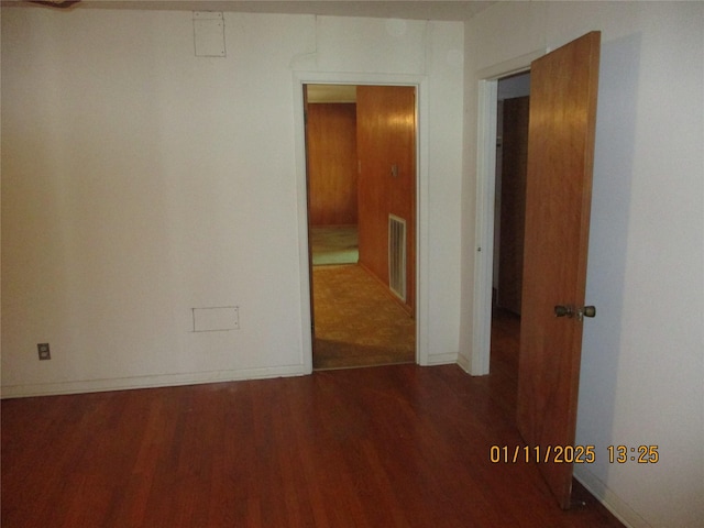 spare room with hardwood / wood-style floors