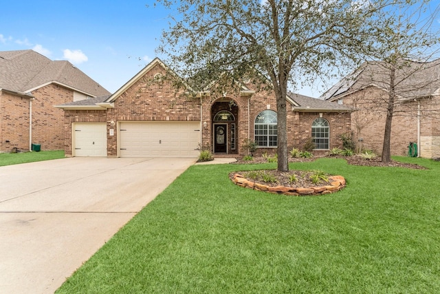 view of front of property featuring a garage and a front lawn