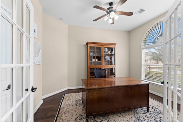 home office with dark hardwood / wood-style floors, french doors, and ceiling fan