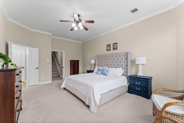 carpeted bedroom with crown molding and ceiling fan