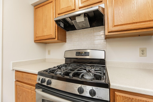 kitchen with stainless steel range with gas cooktop and range hood