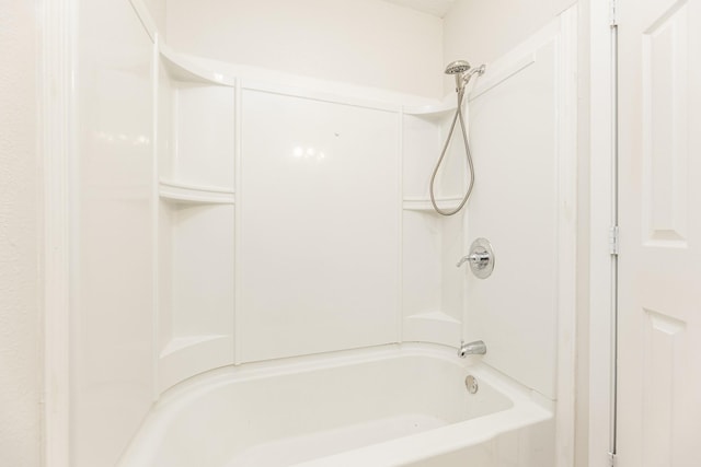 bathroom with washtub / shower combination