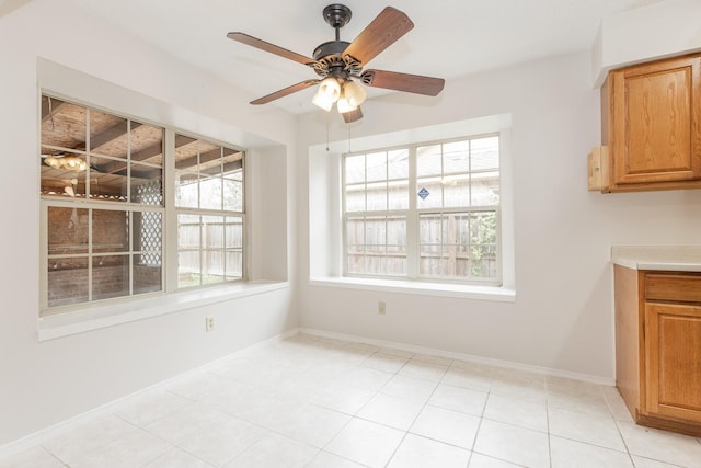 unfurnished dining area with ceiling fan