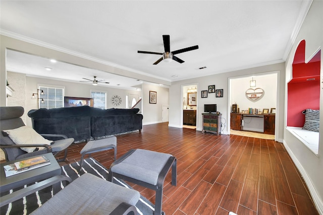 living area featuring dark wood-style floors, ceiling fan, ornamental molding, and baseboards