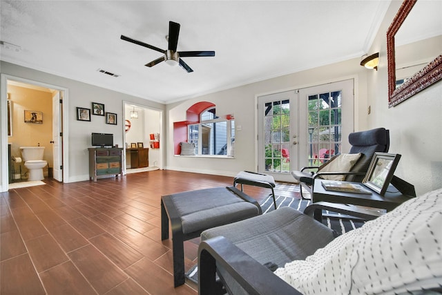 living room featuring baseboards, visible vents, dark wood-style flooring, crown molding, and french doors