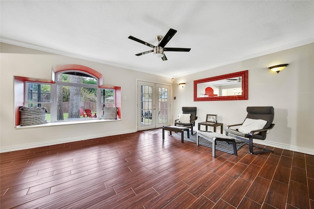 sitting room with a healthy amount of sunlight, ornamental molding, dark wood-style flooring, and french doors