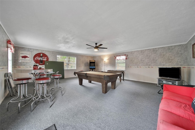 game room featuring ceiling fan, pool table, carpet flooring, crown molding, and a bar