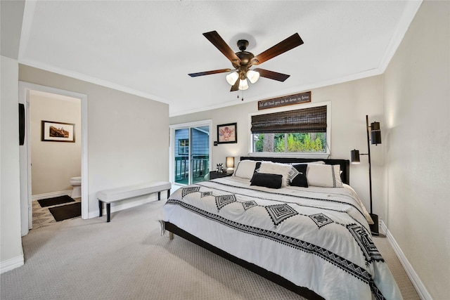 bedroom featuring baseboards, ornamental molding, and light colored carpet