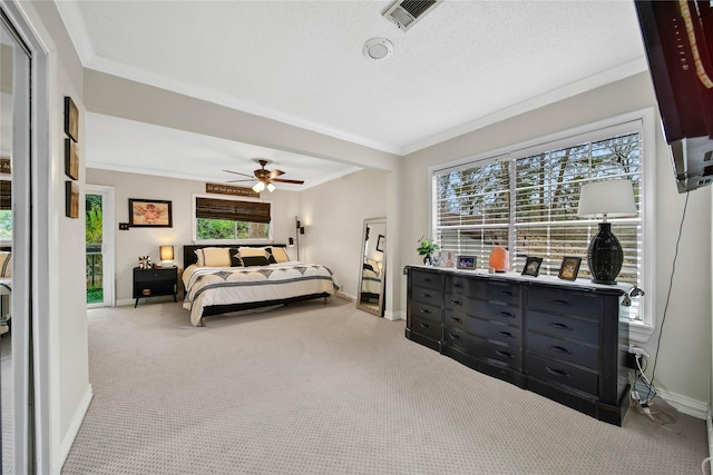 bedroom with light carpet, crown molding, a textured ceiling, and baseboards