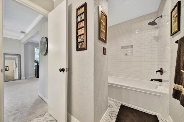 bathroom featuring a textured wall, ornamental molding, shower / tub combination, and baseboards