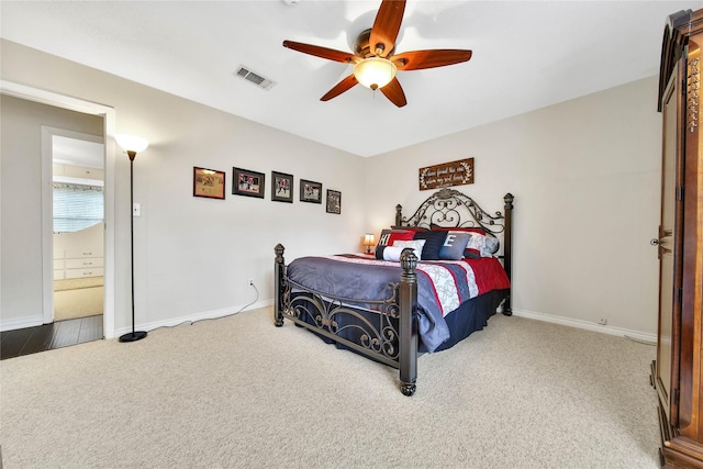 bedroom featuring a ceiling fan, carpet, visible vents, and baseboards