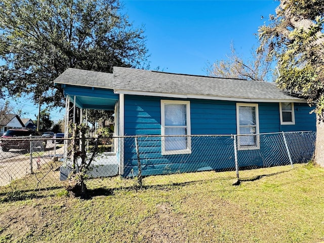 view of side of home with a lawn