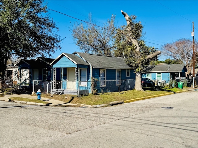 view of front of home with covered porch and a front yard