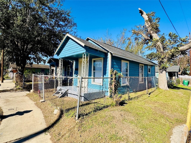 bungalow-style home with a porch and a front yard