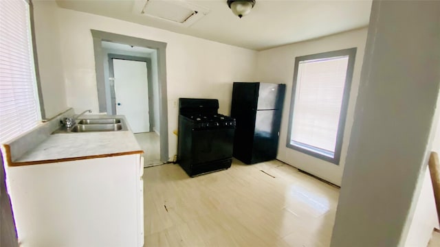 kitchen featuring black appliances and sink