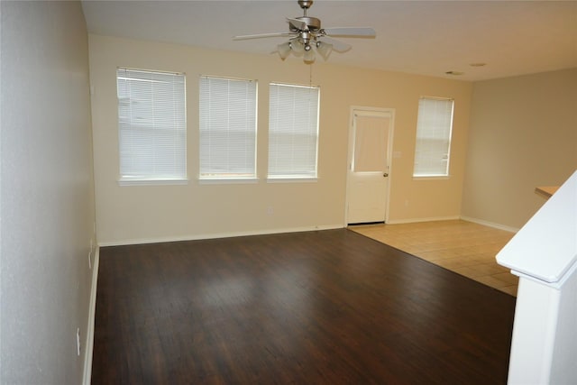 unfurnished room with tile patterned flooring and ceiling fan