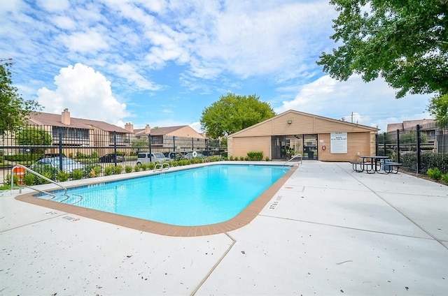 view of swimming pool featuring a patio