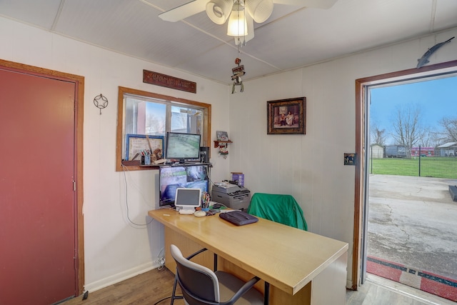 office with plenty of natural light, ceiling fan, and light hardwood / wood-style flooring