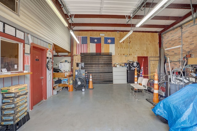 garage featuring wooden walls