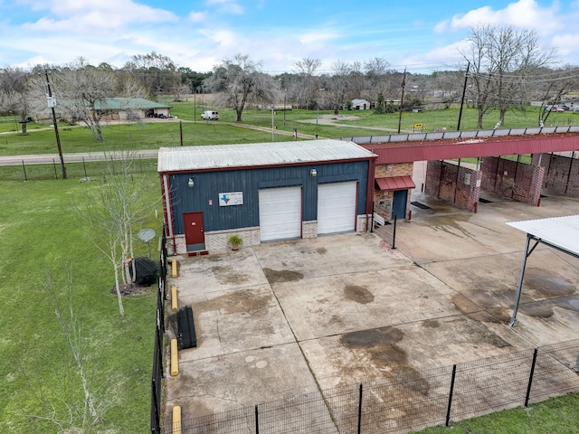 view of patio with a garage and an outdoor structure